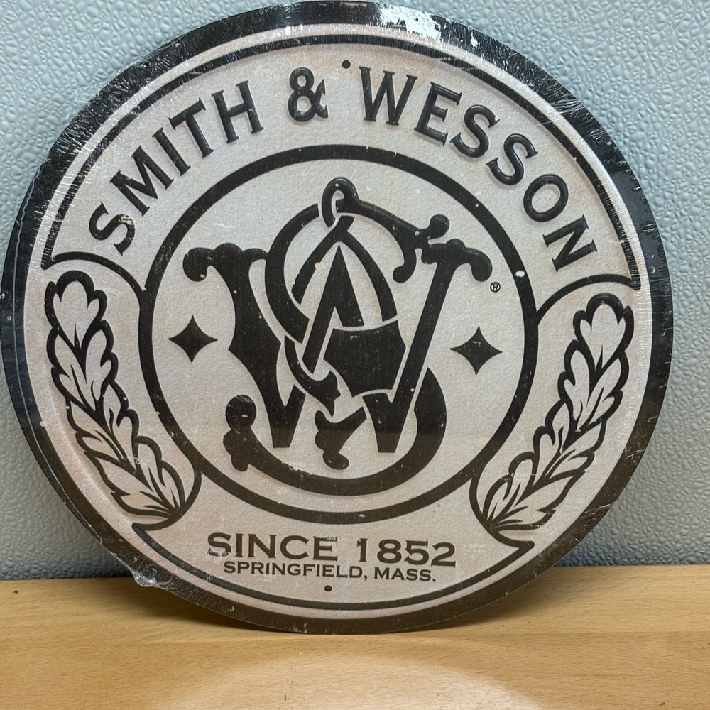 Smith & Wesson 11.5” Metal Sign. Made in the USA, New Sign with aged design.